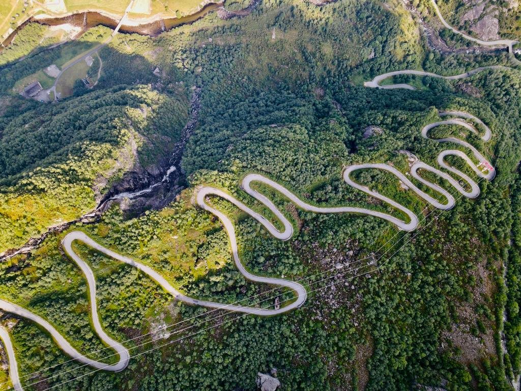 The iconic hairpin bends of the Trollstigen road in Norway - perfect for challenging motorcycle routes.